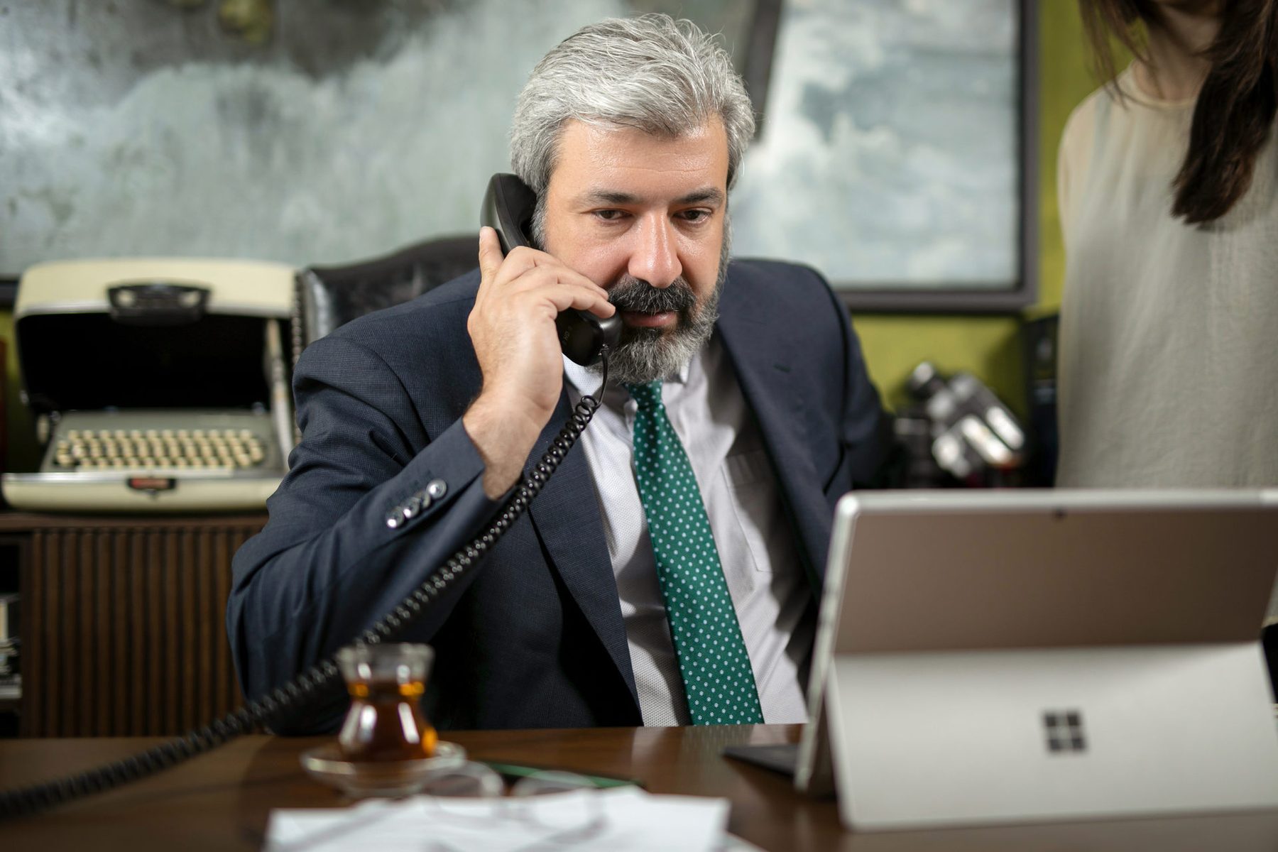 Ali Askari on the telephone at his desk